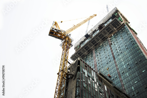 Crane and building construction site photo