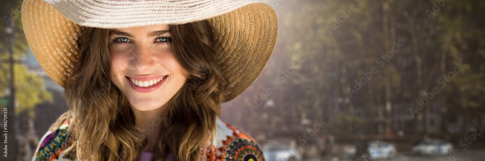 Composite image of beautiful woman with a straw hat Composite image of beautiful woman with a straw hat