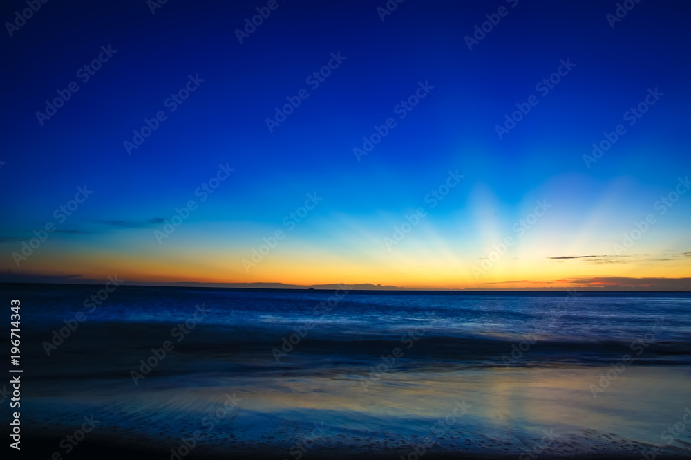 Sunset / sunrise with clouds and sea, light rays and other atmospheric effect Sunset / sunrise with clouds and sea, light rays and other atmospheric effect