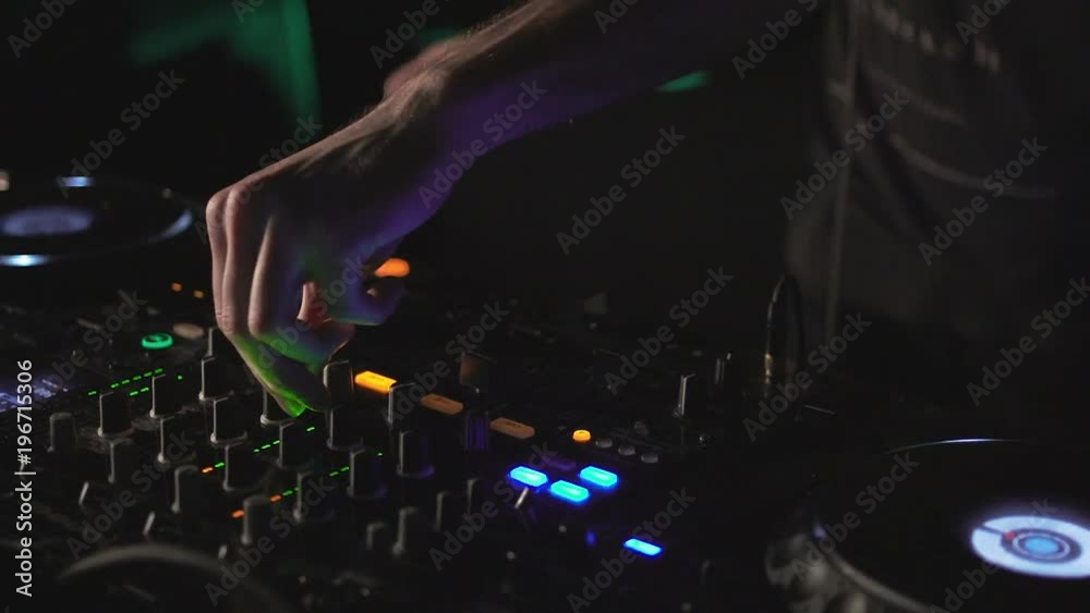 DJ hands on mixer and decks DJ hands on mixer and decks