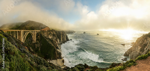 A sweeping panoramic view of Bixby bridge, along the Big Sur coast in northern California. photo