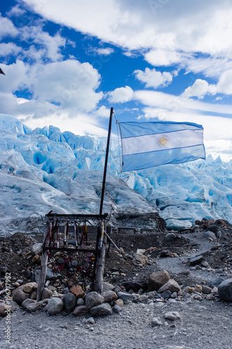 Argentina flag flying in front of Perito Moreno Glacier