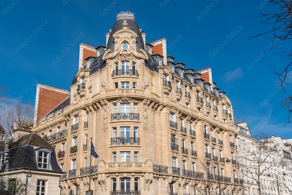 Paris, beautiful building in the center, typical parisian facade
