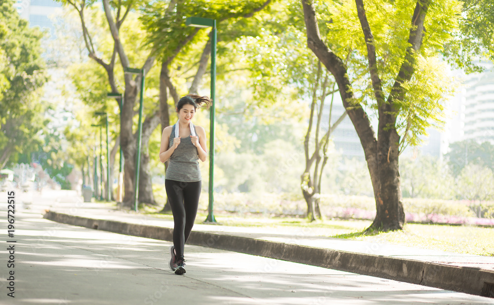 Beautiful Sport woman in sportswear running in the park. Healthy lifestyle and sport concept. Beautiful Sport woman in sportswear running in the park. Healthy lifestyle and sport concept.