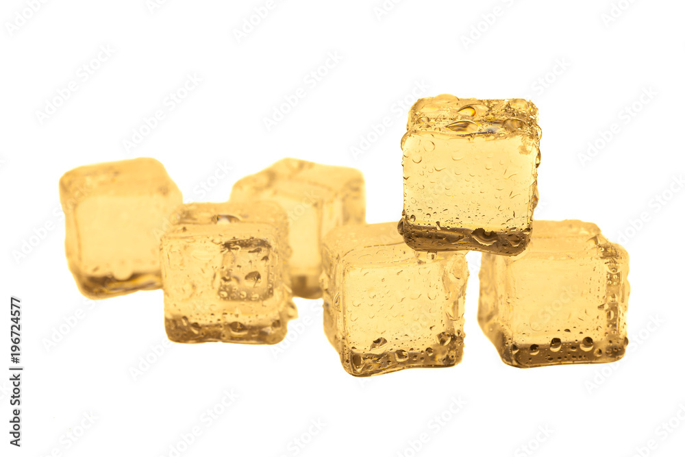 Golden ice cubes on white background. Golden ice cubes on white background.