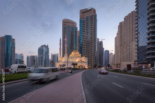 Modern skyline with traffic on streets in Dubai Marina