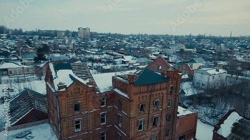 Old crumbling house in the winter photo