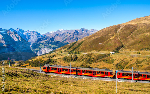  Swiss red train is cimbing to Jungfraujoch the top rail station in Europe.