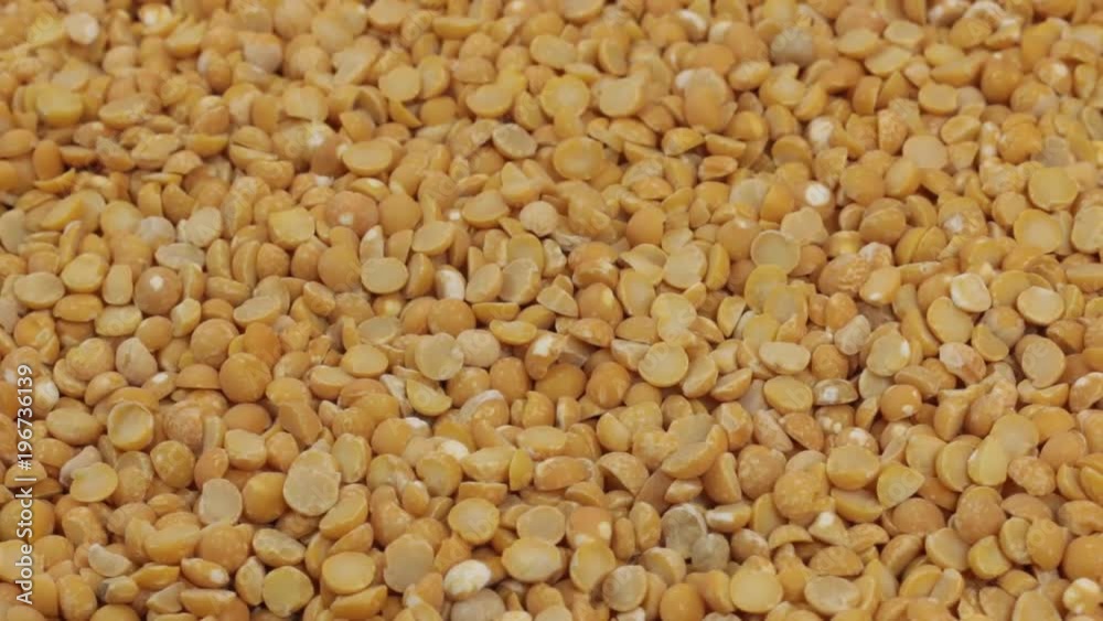 Rotation, background made from a pile of dry peas grains. Rotation, background made from a pile of dry peas grains.