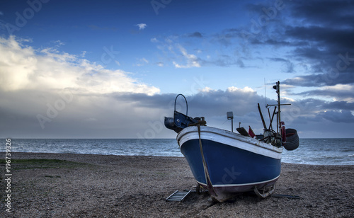 Fishing boat on beach in Hastings in East Sussex landscape