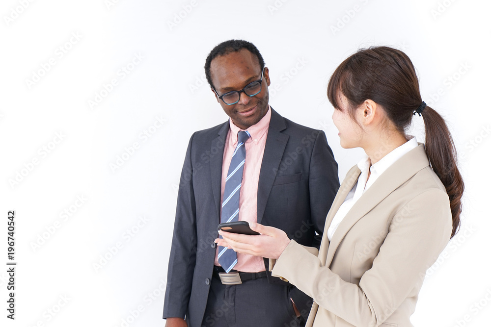 Businesspersons searching location by smartphone Businesspersons searching location by smartphone