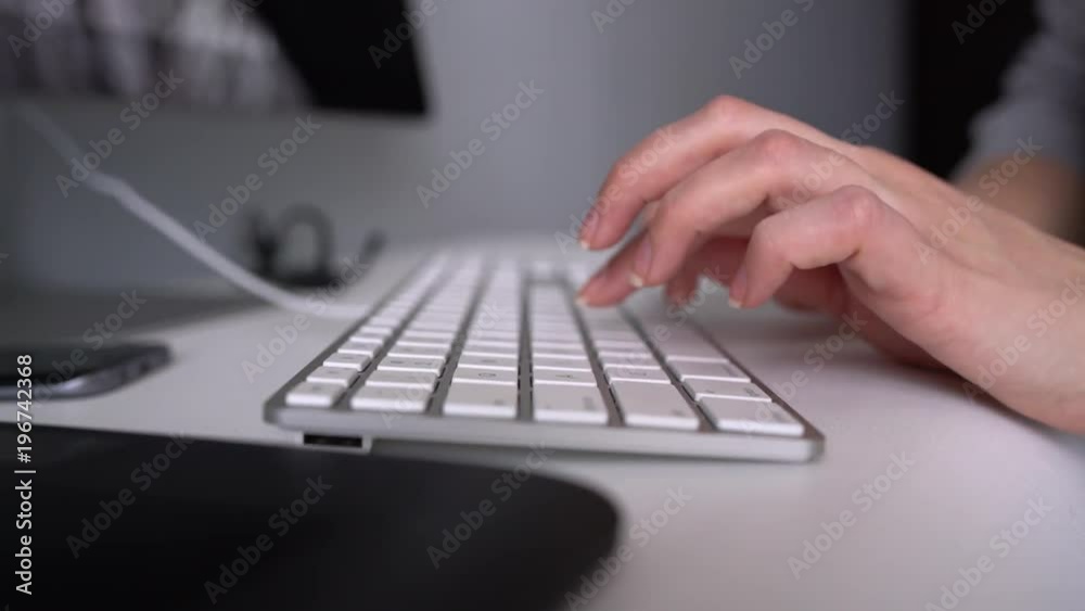 Woman office worker typing on the keyboard Woman office worker typing on the keyboard