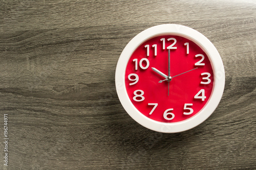 wall clock set on color background. The concept of " time is late"