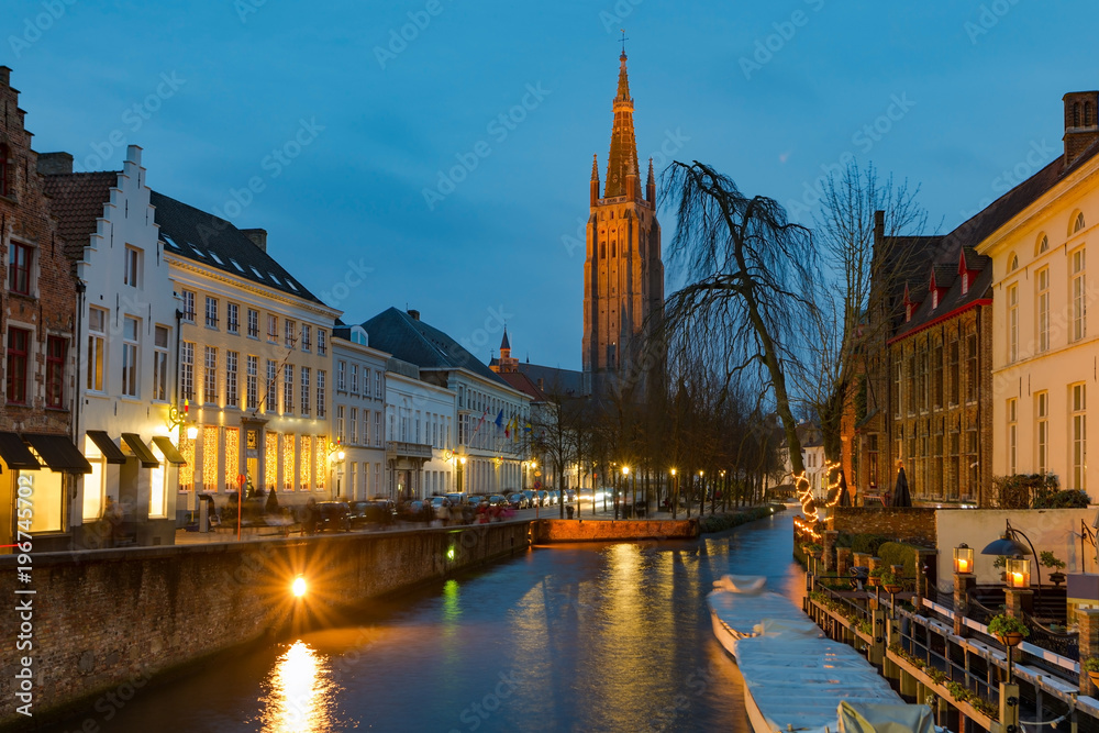 Twilight view of historic medieval centre of Bruges or Brugge, Belgium in Cristmas decorations