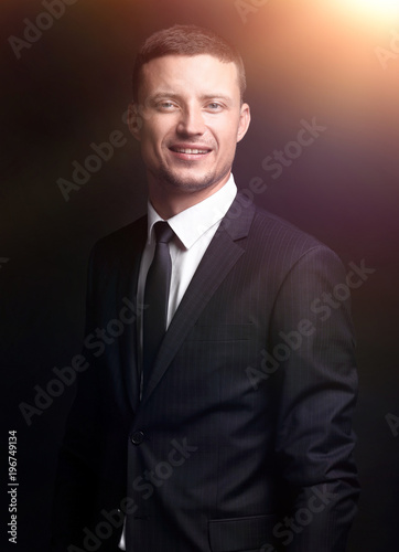 portrait of confident businessman isolated on a black background