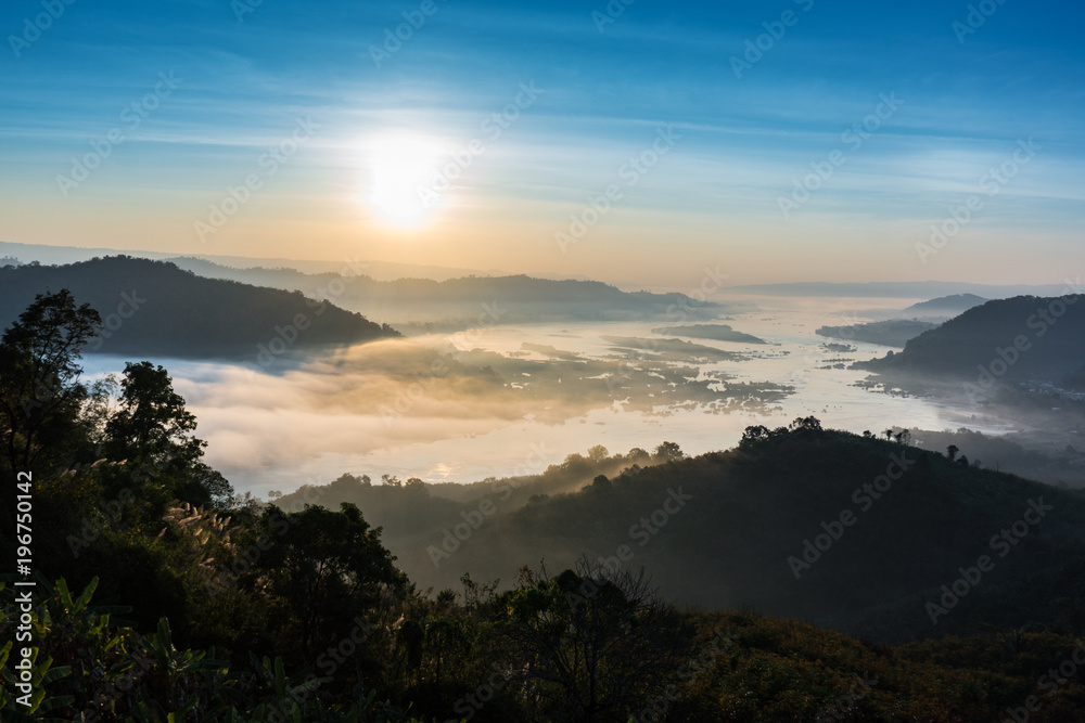 scenery of Mekong river with many fog in morning sunrise, View from viewpoint of Phu huai esun at Nongkhai, Thailand