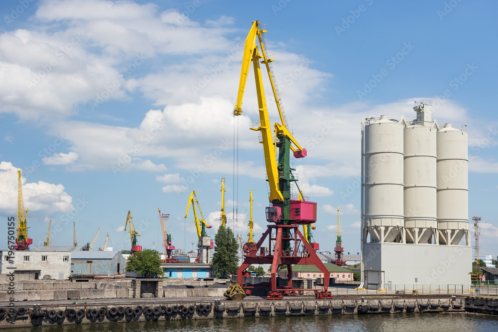 Heavy harbour jib cranes in the Kaliningrad Sea Fishing Port. Heavy harbour jib cranes in the Kaliningrad Sea Fishing Port.