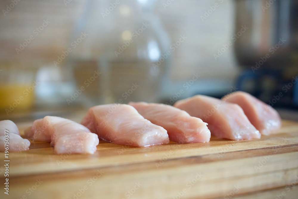The sliced meat. Chicken meat. To cut meat. meat on a wooden Board. The sliced meat. Chicken meat. To cut meat. meat on a wooden Board.