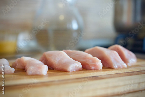 The sliced meat. Chicken meat. To cut meat. meat on a wooden Board.