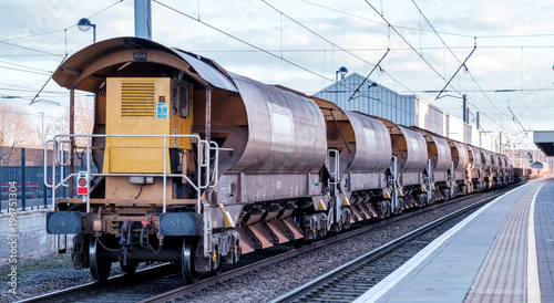 A railway engineering train to deliver ballast on the track