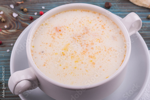 Cheese cream soup, is served with butter and cheese 