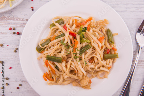 Home-made noodles with vegetables and greens