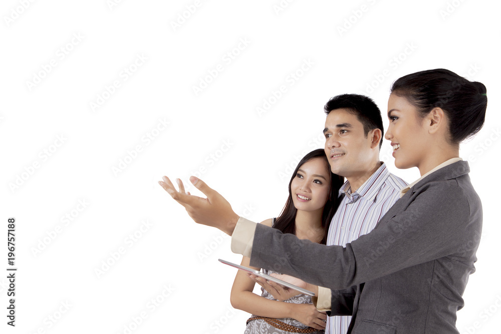 Real estate agent showing something to her customer Real estate agent showing something to her customer