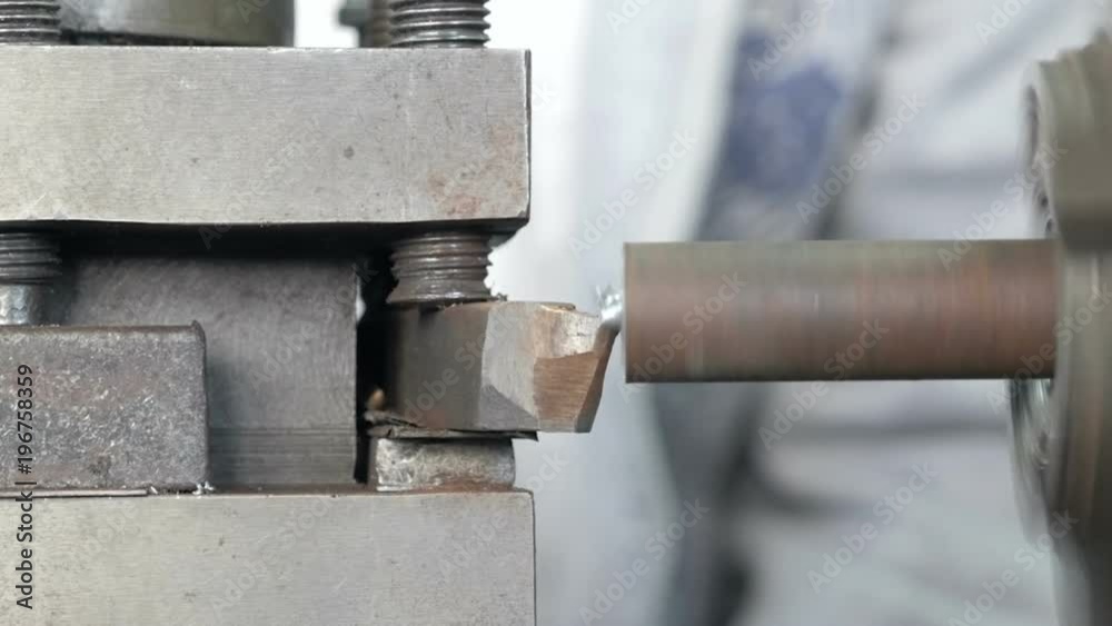 Turning lathe. Facing operation of a metal blank on turning machine with cutting tool.
Turning lathe. Facing operation of a metal blank on turning machine with cutting tool.