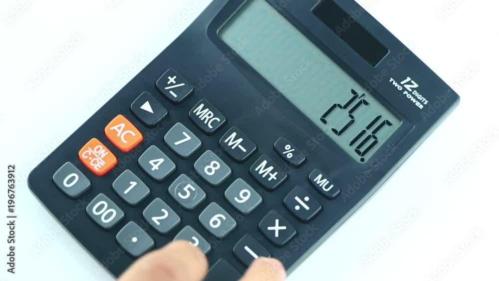 Counting on calculator. Finger presses the button calculator. Closeup. Counting on calculator. Finger presses the button calculator. Closeup.