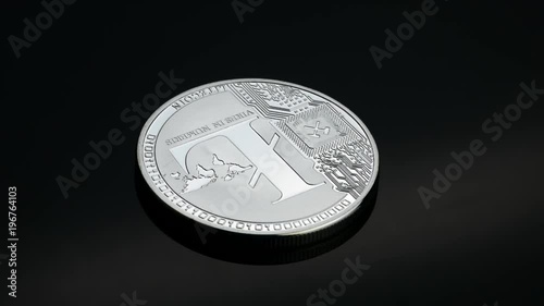 Sivler Litecoin cryptocurrency rotating on the black background business concept photo