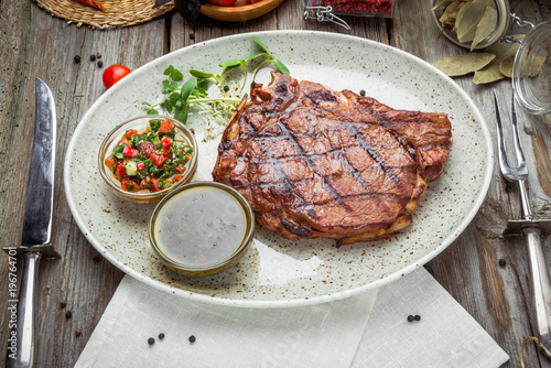 Tenderloin steak on plate with sauce photo