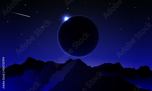 Solar eclipse over the mountains