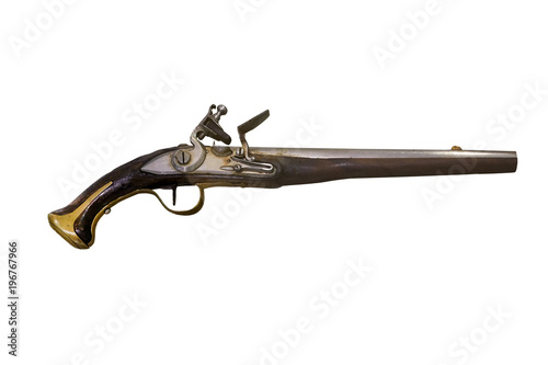 Closeup of 18th century firearms, pistol or musket with wooden handle and bronze rim.