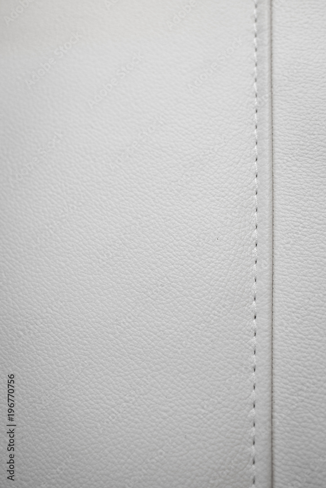 Fototapeta premium White leather texture with seams in close-up as a background