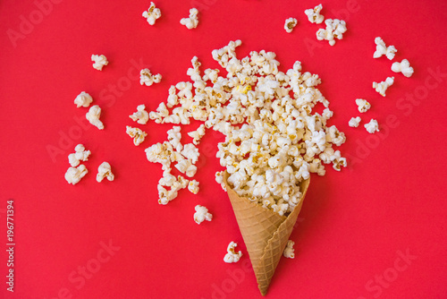 popcorn in a wafer for ice cream on a red background