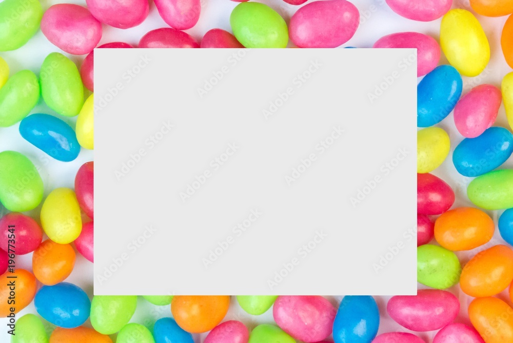 Colorful jelly bean background with white square space for text