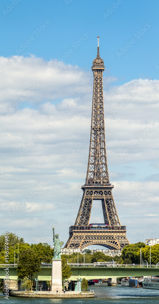 Eiffel Tower and Liberty statue in Paris