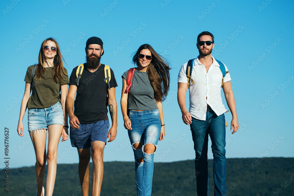 Men and women travel on summer vacation