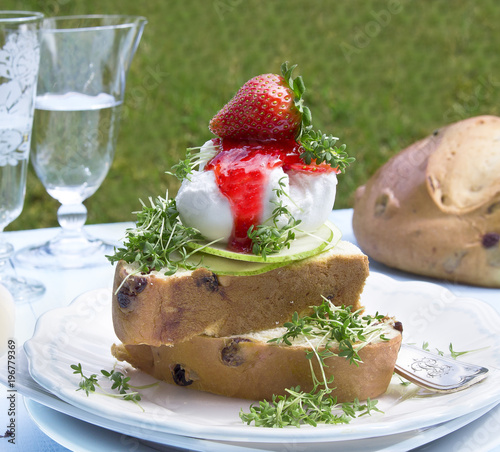 brioche with raisins and strawberries jam photo