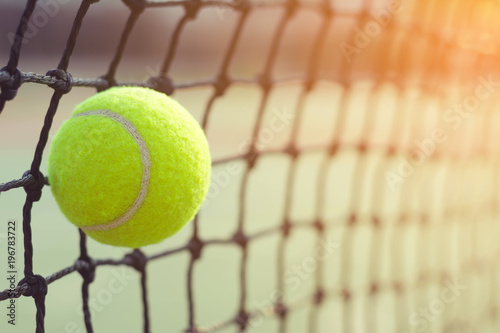 Close up tennis ball hitting to net on blur background  © WK Stock Photo 