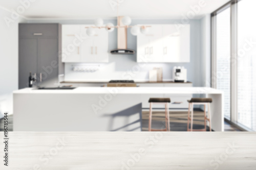 White kitchen  gray counters  table blur