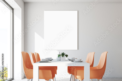 White dining room, orange chairs, poster close up © ImageFlow