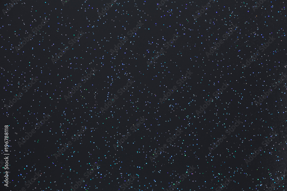 Shiny points on a dark backgrounds that look like starss in the night sky