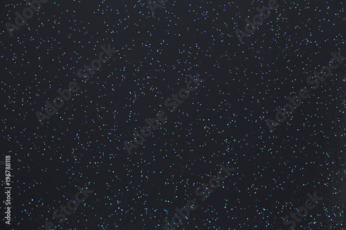 Shiny points on a dark backgrounds that look like starss in the night sky