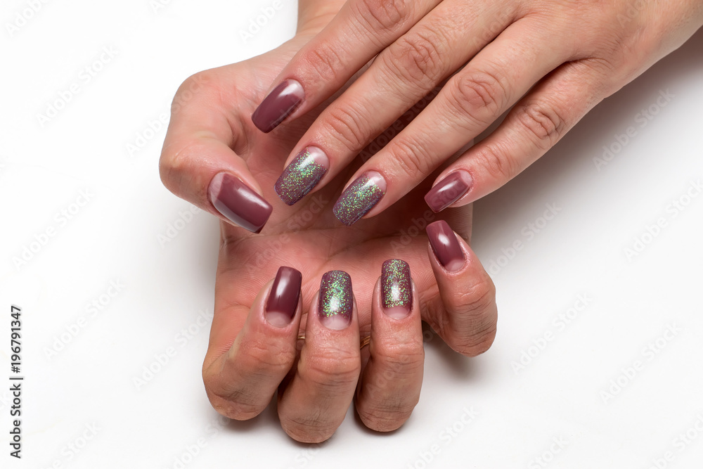 beige manicure dior with sequins on long square nails on a white background on tanned hands beige manicure dior with sequins on long square nails on a white background on tanned hands
