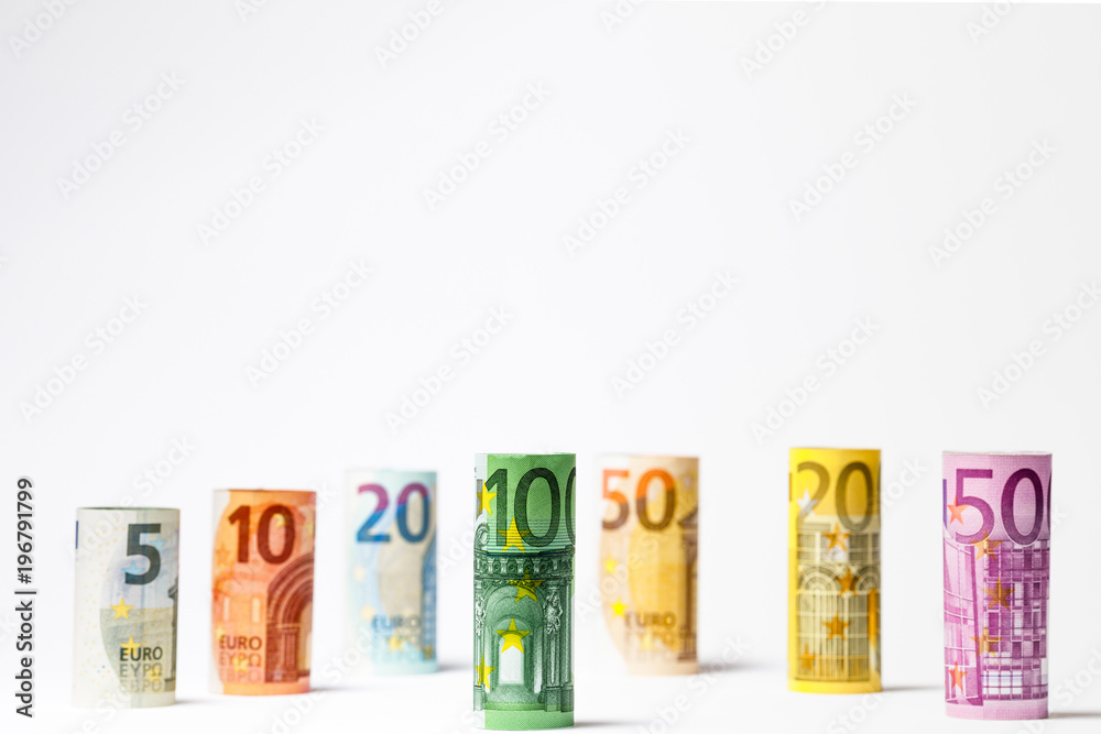 Several hundred euro banknotes stacked by value.Rolls Euro bankn Several hundred euro banknotes stacked by value.Rolls Euro bankn