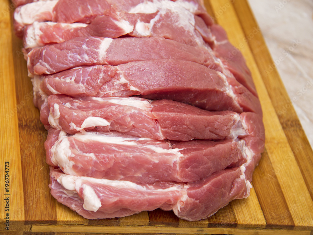 Pork meat slices prepared for cooking steak Pork meat slices prepared for cooking steak