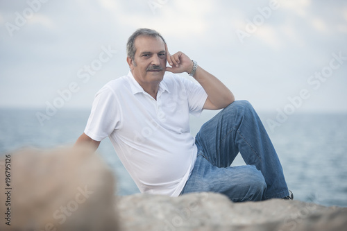 Mature man posing on vacation