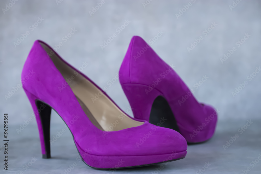 Fuchsia velvet shoes heels on gray background. Fuchsia velvet shoes heels on gray background.