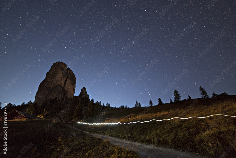 Light trail during a starry night on Cinque Torri, Dolomites, Cortina  d'Ampezzo, Belluno province, Veneto, Italy Stock Photo | Adobe Stock